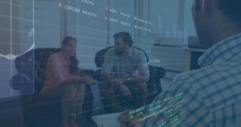 Team analyzing financial data in modern office lounge