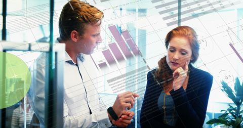 Caucasian Team Discussing Business Data in Modern Office