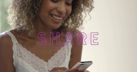 Smiling woman tapping smartphone, sharing content, neon share text overlay, lace camisole