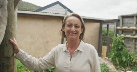 Senior Woman Enjoying Outdoor Home Garden Environment