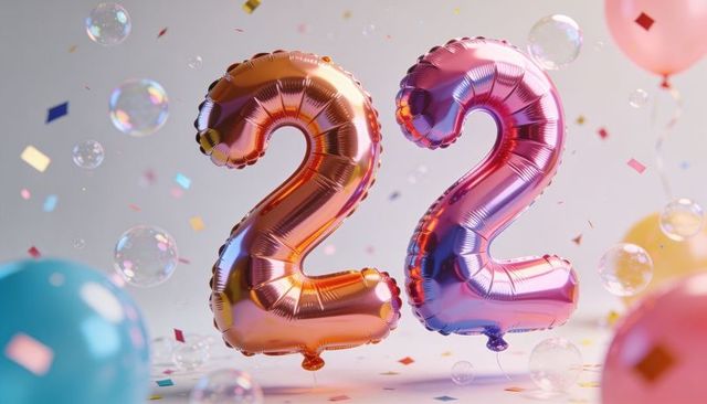 Floating shimmering iridescent foil number 22 balloons with confetti, bubbles, pastel latex decor