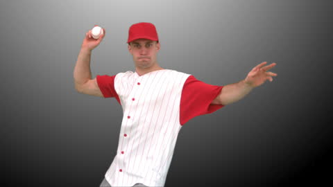 Focused Baseball Player Throwing Ball in Studio