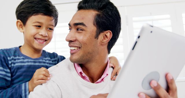 Father and Son Bonding Time Using Tablet at Home - Download Free Stock Images Pikwizard.com