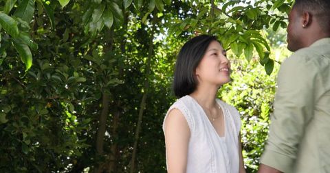 Joyful Couple Dancing Together in Lush Garden Celebration Outdoor
