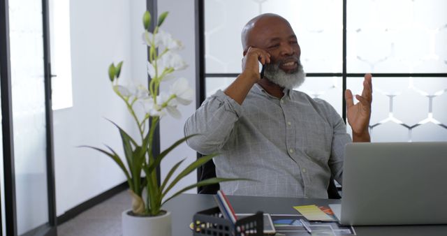 Confident Senior Businessman on Phone Call in Modern Office - Download Free Stock Images Pikwizard.com