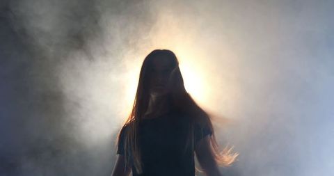 Mystical silhouette of enigmatic dancer moving gracefully