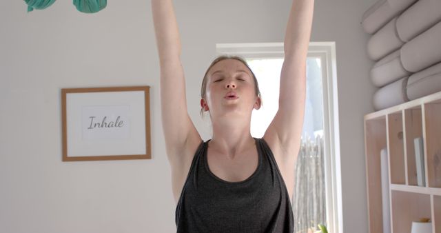 Woman Practicing Yoga at Home with Calm Expression - Download Free Stock Images Pikwizard.com