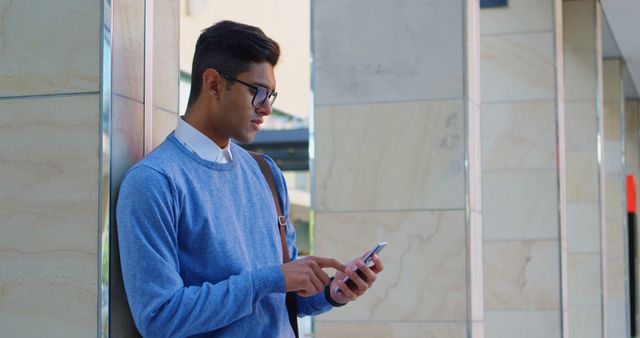 Young Man Using Smartphone Outside Office Building - Download Free Stock Images Pikwizard.com