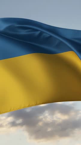 Vertical video Ukrainian flag fluttering in wind over sky for patriotism and solidarity