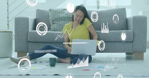 Woman working from home on laptop with digital data overlays, remote work productivity