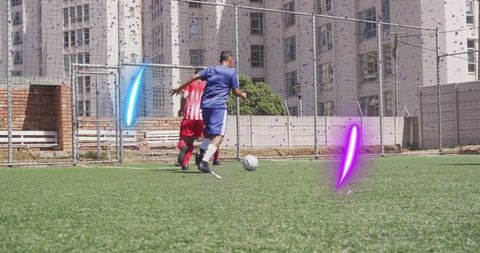 Youth soccer players competing on urban turf field