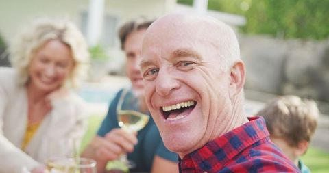 Joyful Senior Caucasian Man Enjoying Family Time in Garden