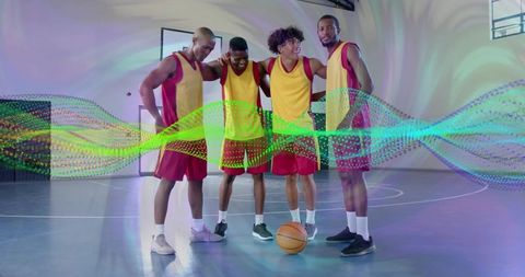 Athletes huddling on basketball court with digital effects
