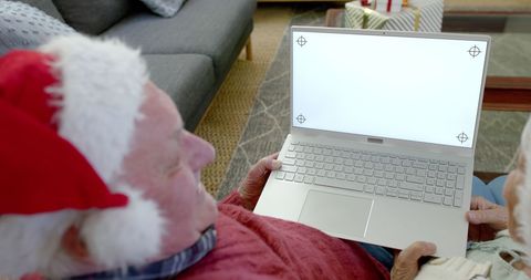 Elderly Couple Sharing Holiday Spirit with Laptop - Download Free Stock Images Pikwizard.com