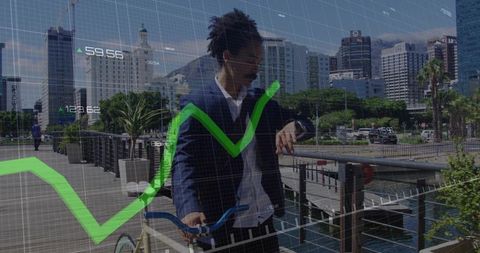 Business commuter checking watch while holding bicycle by waterfront with financial overlay