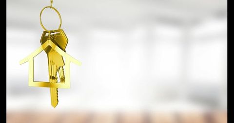 Gold Keychain in Shape of House Symbolizing New Home