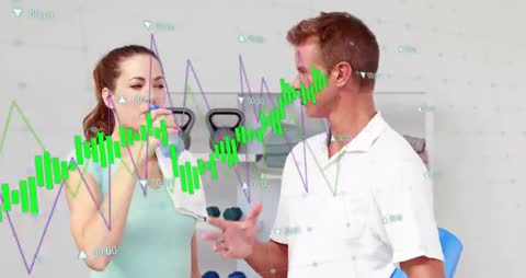 Trainer Motivating Client with Energizing Talk Break in Gym