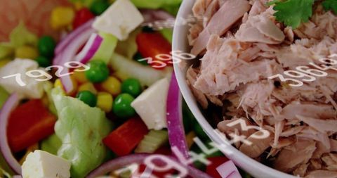 Flaked tuna bowl with fresh garden salad, red onion and feta nutrition and calorie overlay