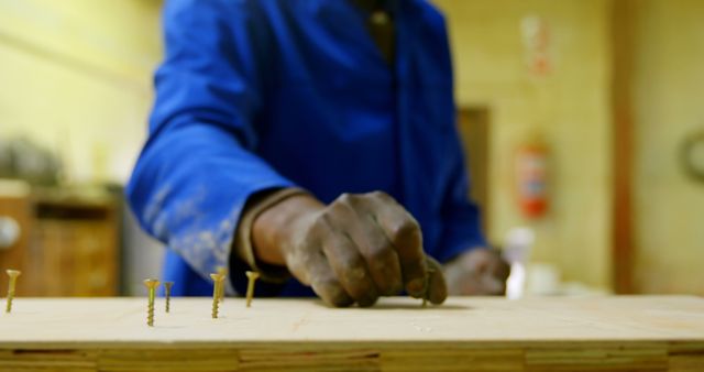 Close-Up of Carpenter Gripping Nail in Workshop - Download Free Stock Images Pikwizard.com