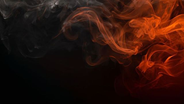 Abstract Smoke Patterns in Red and Gray on Dark Background