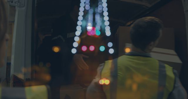 Workers Loading Truck at Night with Blurred Lights - Download Free Stock Images Pikwizard.com