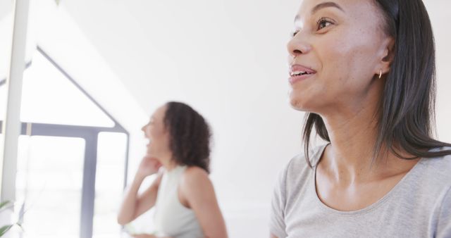 Two Smiling Women Having Fun Indoors - Download Free Stock Images Pikwizard.com