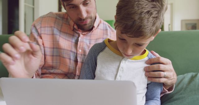 Father and Son Using Laptop at Home for Learning - Download Free Stock Images Pikwizard.com