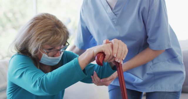 Caregiver Assisting Elderly Woman with Walking Aid in Home Setting - Download Free Stock Images Pikwizard.com