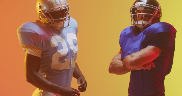 Two American football players in uniforms and helmets standing with intense expressions against a colorful background of orange and yellow. Could be used for sports advertisements, editorials, motivational posters, promotional materials, or any context that emphasizes competition and teamwork.