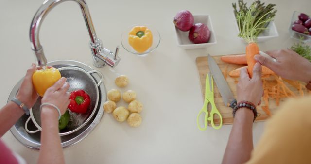 Couple Washing and Preparing Fresh Vegetables in Modern Kitchen - Download Free Stock Images Pikwizard.com