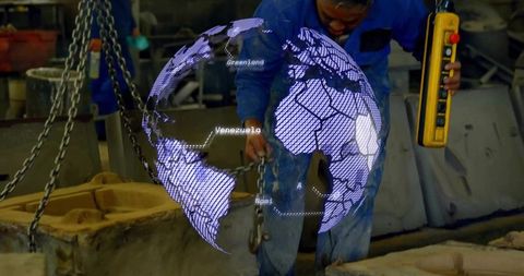 Industrial technician operating crane with digital projection