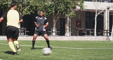 Soccer Training on Sunlit School Field Enhancing Teamwork