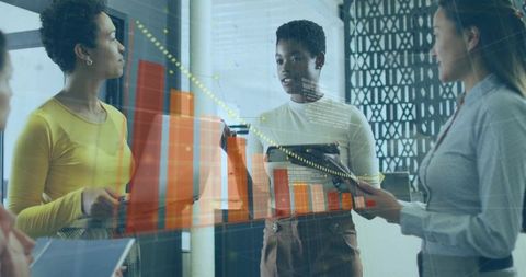 Team Collaborating on Data Analysis with Advanced Technology