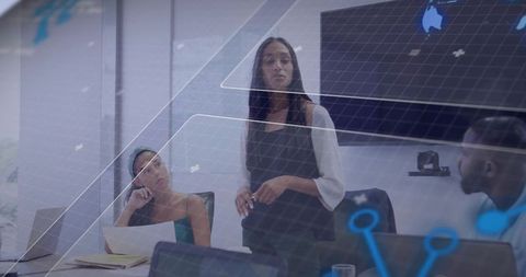 Professional Businesswoman Presenting Analytics in Modern Boardroom