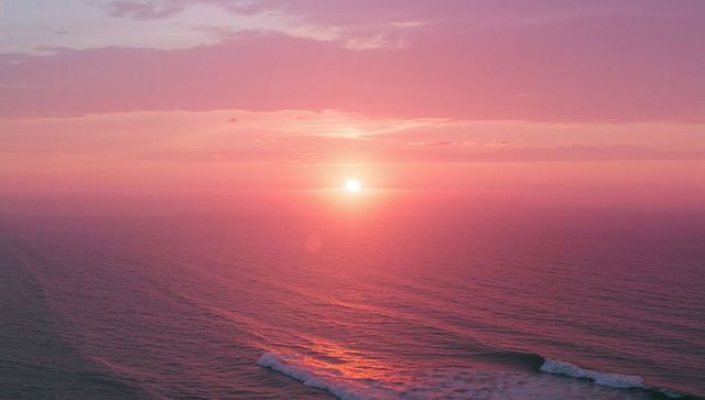 Tranquil Ocean Sunset with Purple and Pink Hues