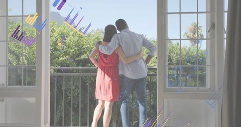 Romantic couple embracing on balcony overlooking garden with colorful graphic overlays