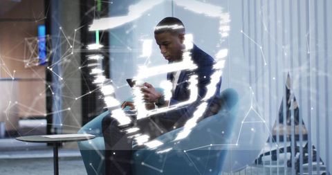 Businessman connecting securely in modern office with tech overlay