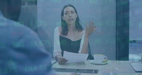 professional discussing financial documents in modern office setting, with overlay of global market data and stock percentages. ideal for concepts of teamwork, financial analysis, economic trends, and digital technology in business environments. useful for corporate presentations, educational materials on finance, or illustrating data-driven decision-making.