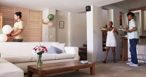 Friends Decorating Home for Party, Snack and Balloon Preparations