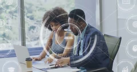 Business Team Analyzing Data on Laptop with Digital Interface Elements