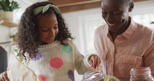 Mother and Daughter Learning Sustainable Practices in Kitchen - Download Free Stock Images Pikwizard.com