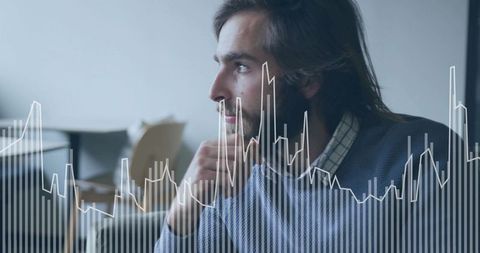 Pensive man analyzing digital data overlay in coworking space for business analytics