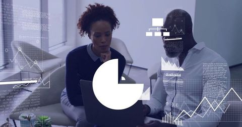 Business professionals analyzing data on laptop with overlay graphics