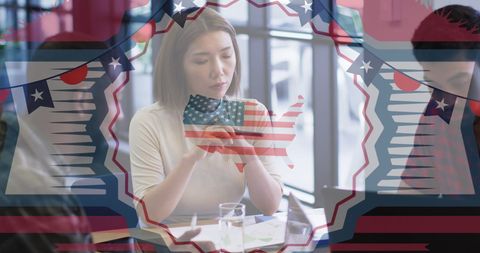 Thoughtful Young Woman Holding American Flag in Patriotic Setting