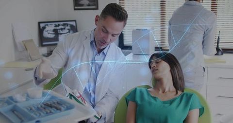 Dentist explaining treatment plan to relaxed patient with augmented reality dental overlay