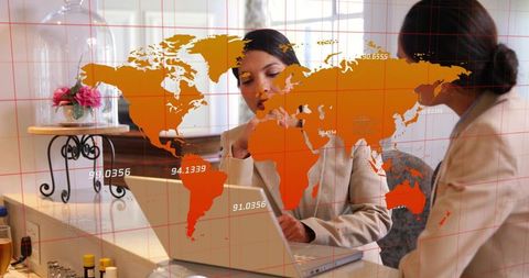 Consulting colleagues at reception desk with world map overlay for global collaboration