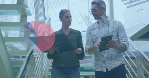 Colleagues Analyzing Financial Data on the Move