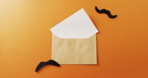 Open Envelope with Moustaches on Orange Background