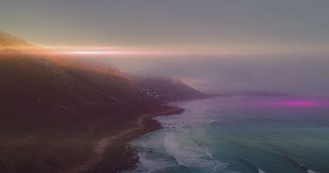Vibrant Light Trail over Tranquil Coastal Sunset