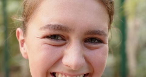 Happy Child Smiling Outdoors Close-Up